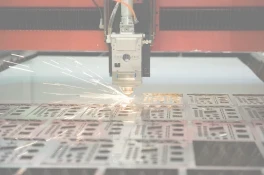 Fiber laser cutting fine detail in steel plate